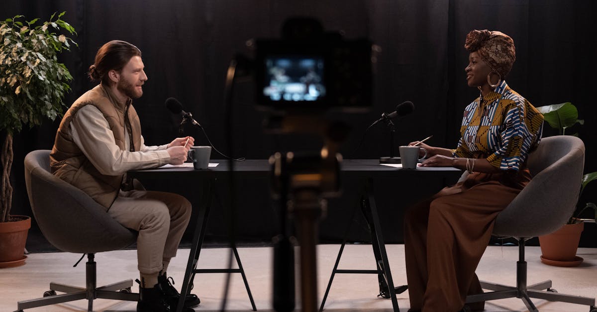 Modern television production studio with broadcasting equipment and control room