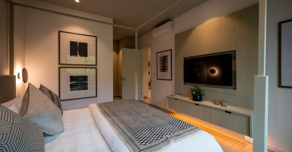 Bright living room featuring layered rugs, plants, and smart lighting for a fresh 2026 look