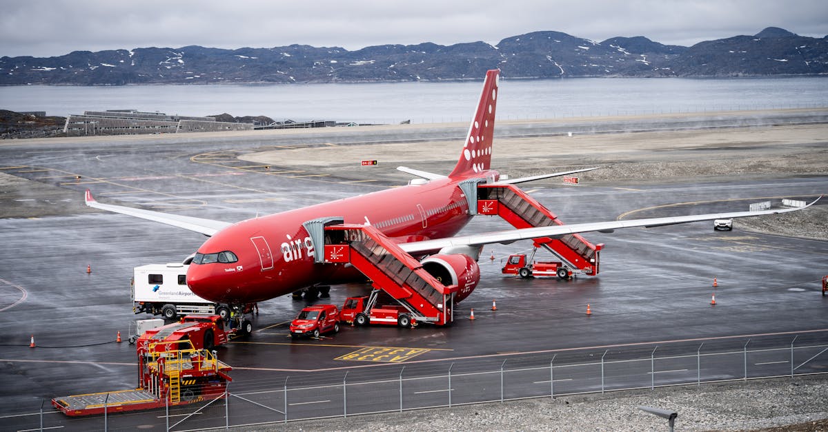 Danish Prime Minister Mette Frederiksen hugs Greenland Prime Minister Jens-Frederik Nielsen upon arrival in Nuuk