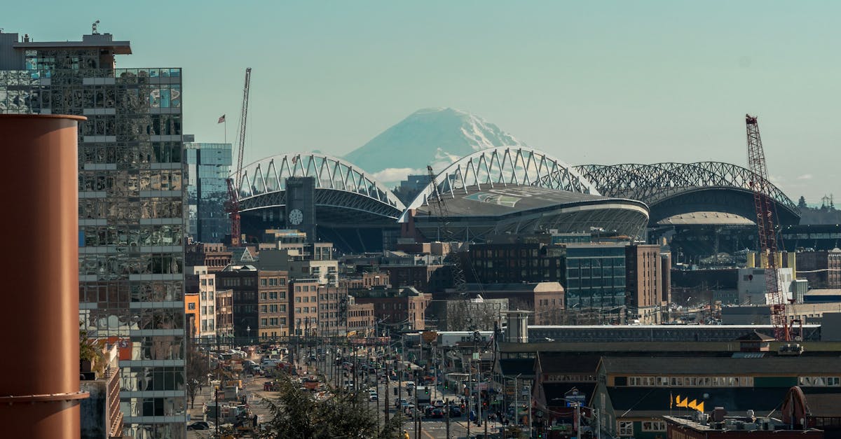 Seattle Seahawks quarterback Sam Darnold passes to wide receiver Jaxon Smith-Njigba during a 2025 NFL game at Lumen Field