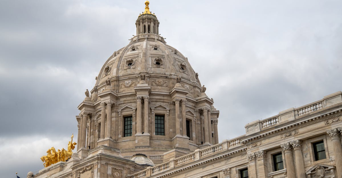 Minnesota state capitol and Minneapolis skyline during federal immigration operation tensions