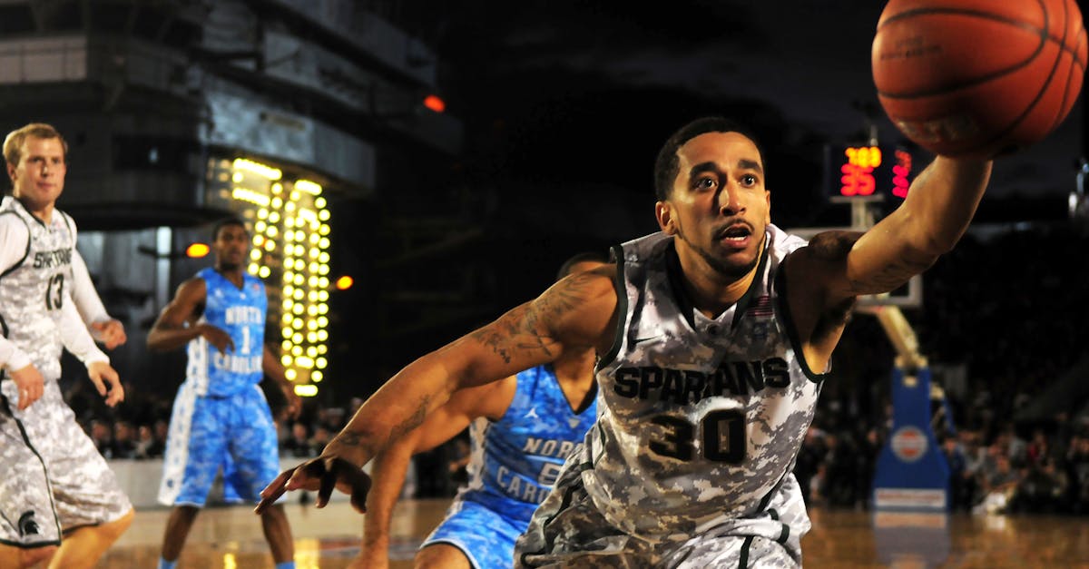 Basketball players competing in NBA game for fantasy league analysis