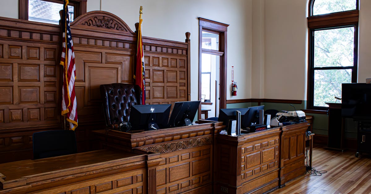 Interior view of a federal courthouse with judge's bench and legal proceedings setup