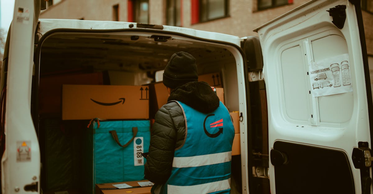 A delivery worker on a motorcycle carrying packages in an urban Indian neighborhood