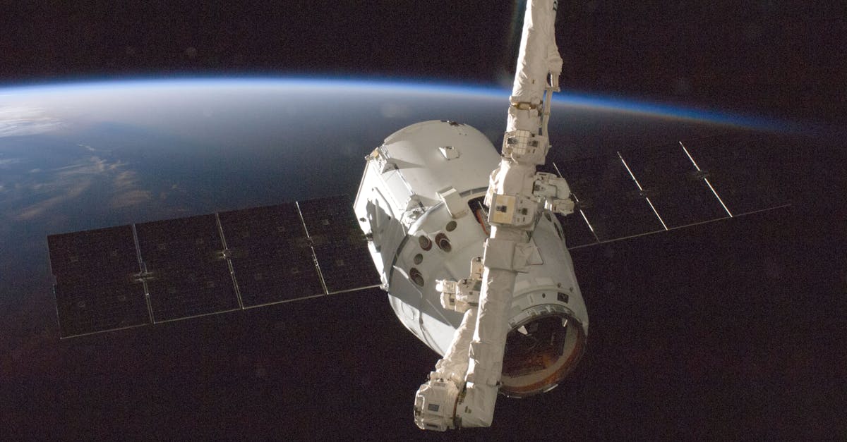 Illustration of crowded low Earth orbit with satellites and debris risking collisions