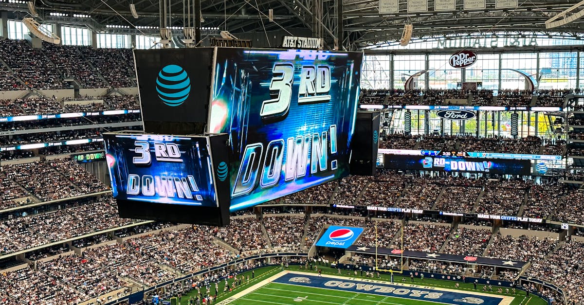 Football stadium during NFL playoff game with crowds in stands