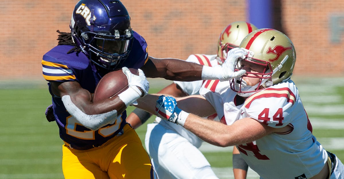 Ole Miss quarterback Trinidad Chambliss throwing a pass during a college football game
