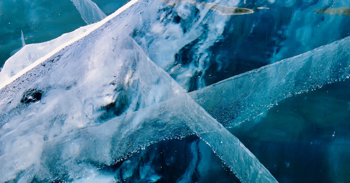 Satellite view of Antarctica's ice sheet surface showing subtle undulations that reveal hidden bedrock features beneath