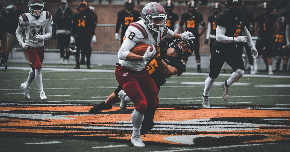 Indiana Hoosiers and Miami Hurricanes players in action during CFP National Championship game