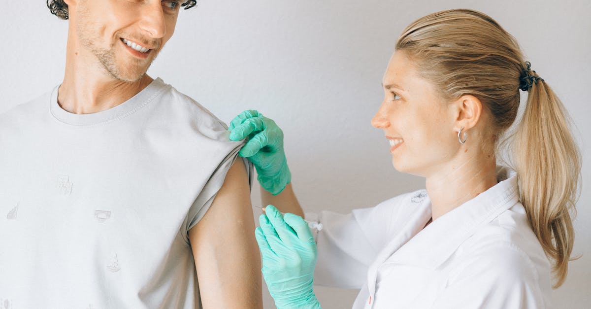 A healthcare worker administers a measles vaccine injection to a patient's arm
