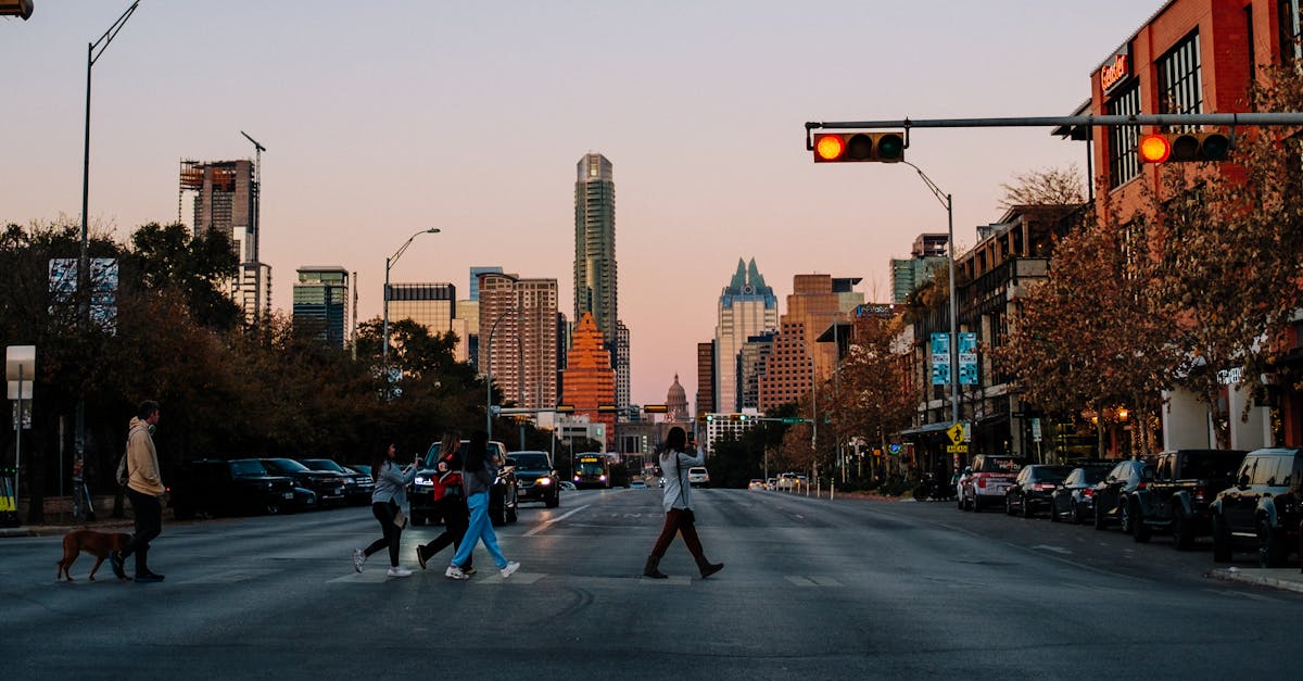 Tesla Cybercab robotaxi vehicle driving autonomously on a street in Austin, Texas