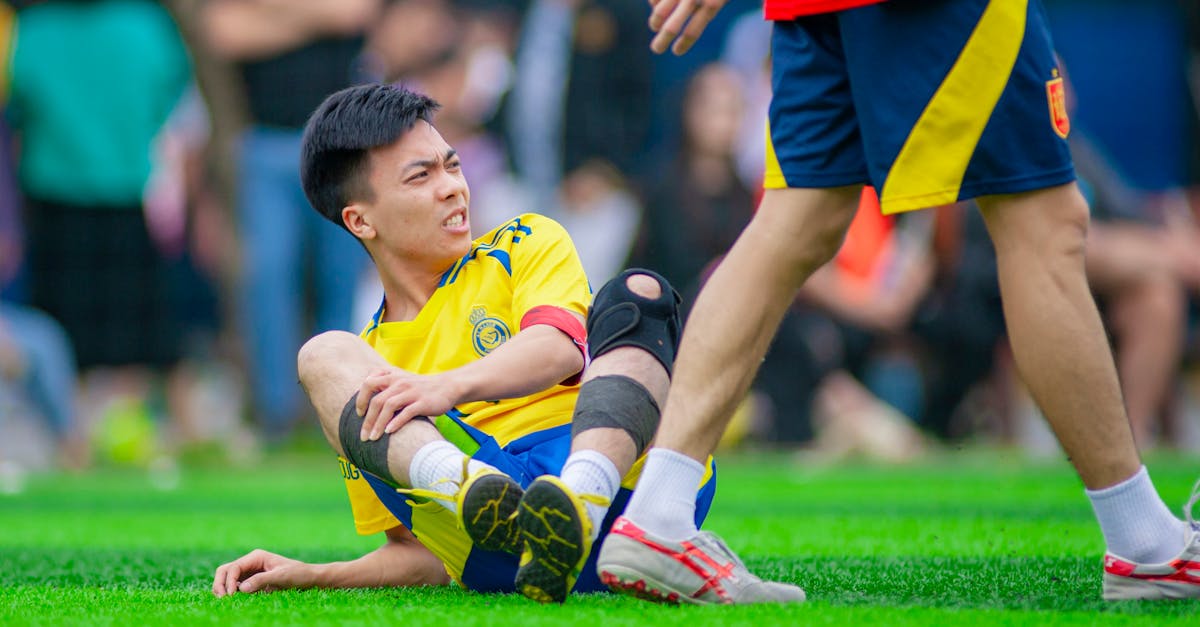 Trae Young in Washington Wizards jersey sitting on bench during injury recovery