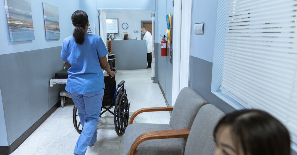 Filipina nurse supervisor standing in a dimly lit Los Angeles hospital corridor with faint ghostly figures in background
