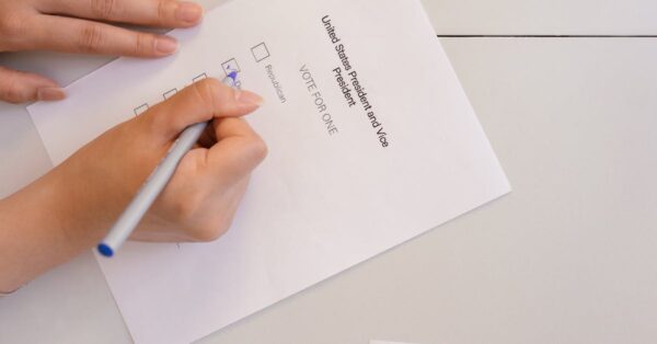 Academy member preparing to cast their Oscar vote with ballot materials