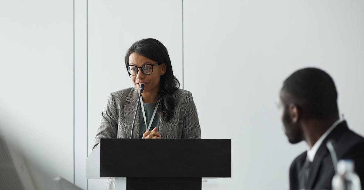 Airbnb CEO Brian Chesky at a podium during company earnings presentation
