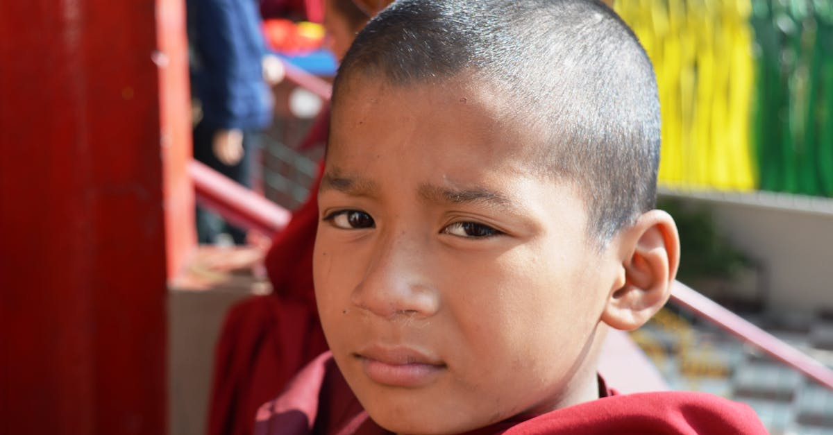 Dalai Lama in robes with Grammy award emblem representing his 2026 win