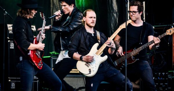 Bruce Springsteen on stage with guitar and E Street Band during concert