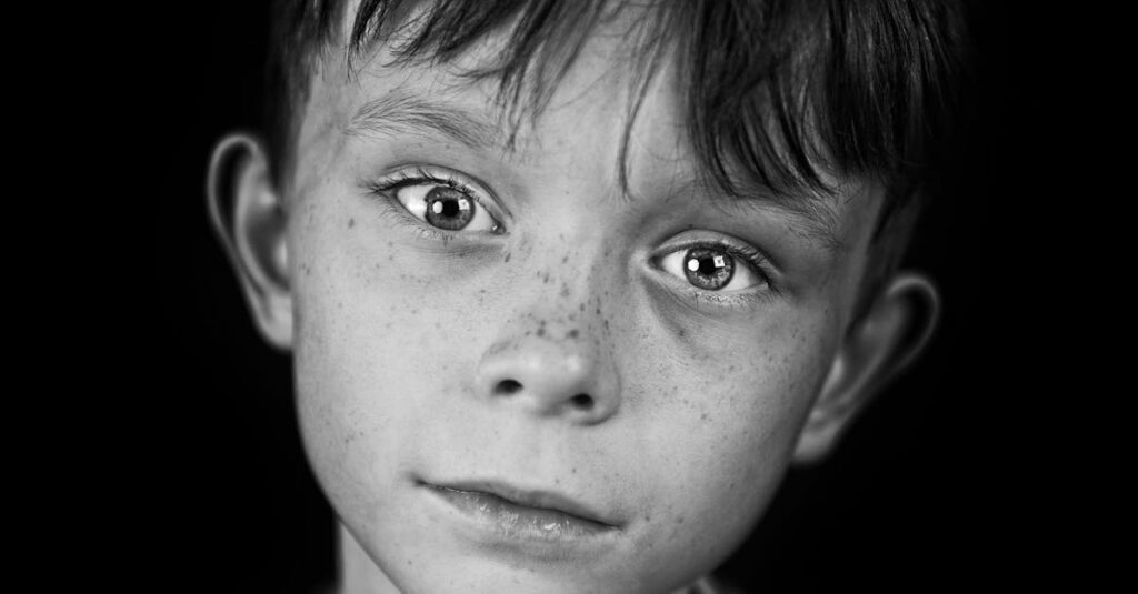 Black and white portrait of astronomer Carl Sagan looking thoughtful
