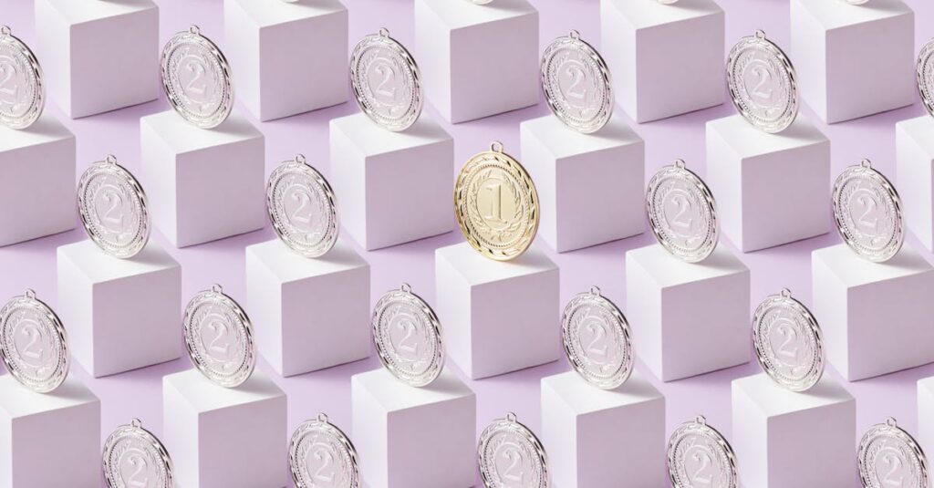 Madison Chock and Evan Bates stand on the silver medal podium in ice dance at the 2026 Winter Olympics with French gold medalists