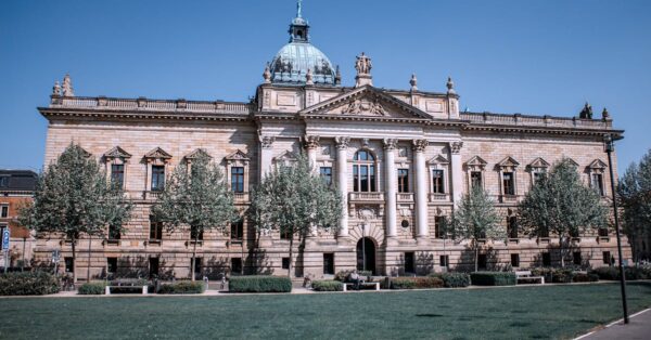 Exterior view of a federal courthouse building with classical architecture and steps