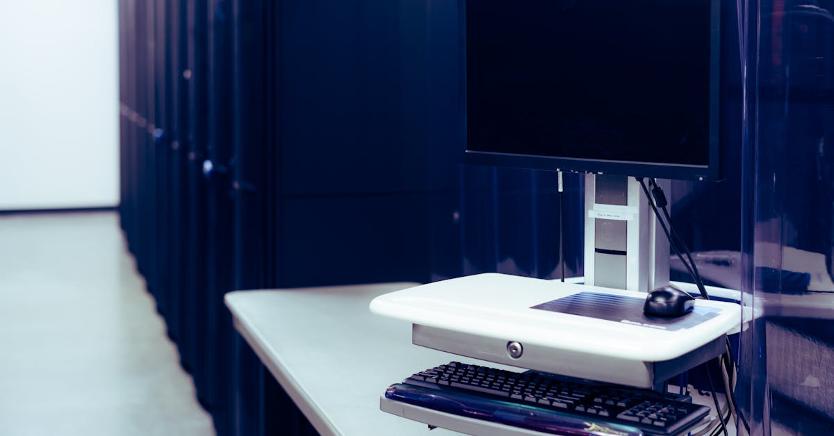 Interior view of a modern data center with rows of server equipment and blue lighting