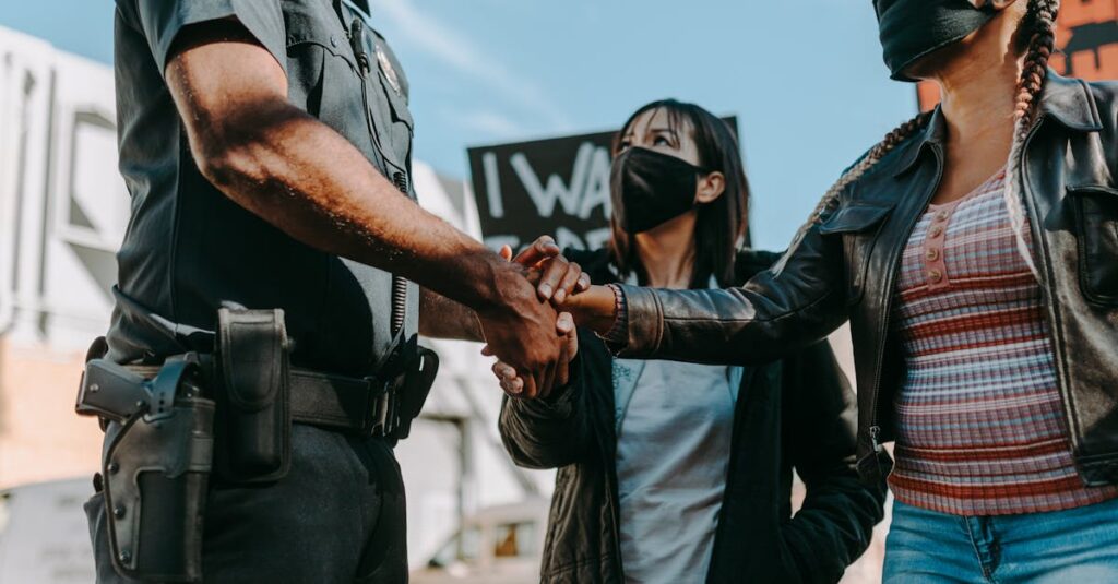 Minneapolis street scene with federal agents and protesters during immigration operation
