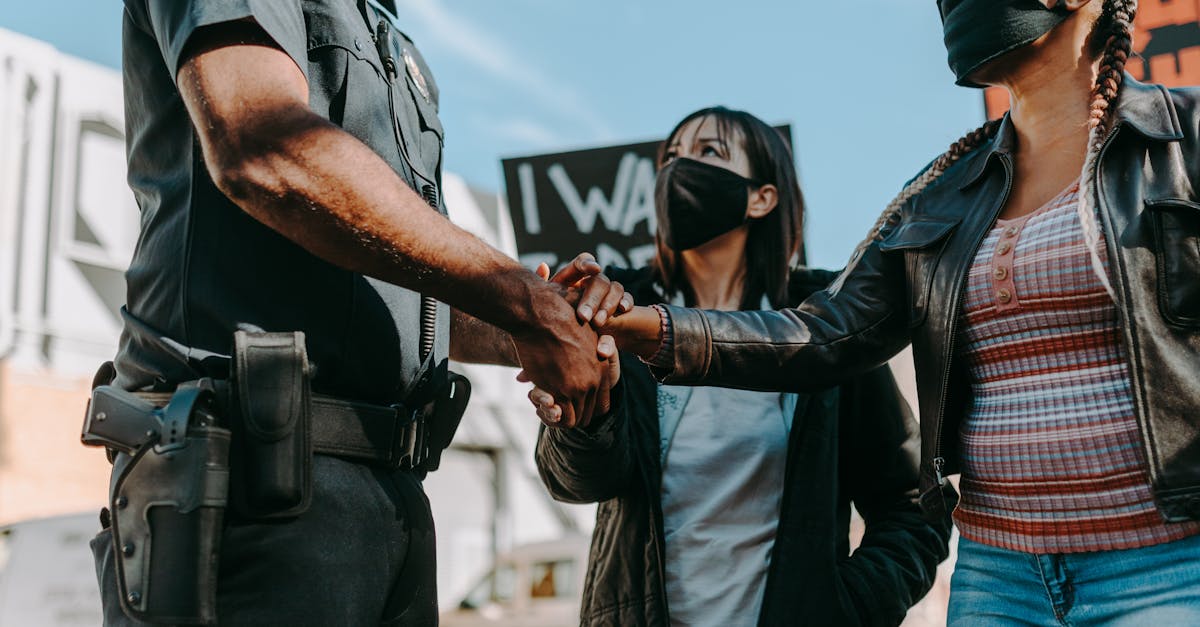 Minneapolis street scene with federal agents and protesters during immigration operation