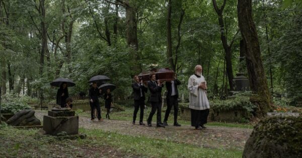 Mourners carry coffin at funeral of Palestinian-American teen killed in West Bank