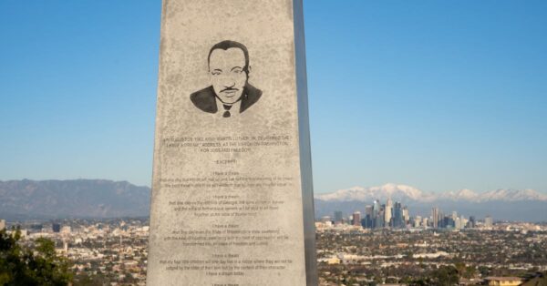 Artemi Panarin with Los Angeles Kings No. 72 jersey and mascot Bailey holding Rolex watch