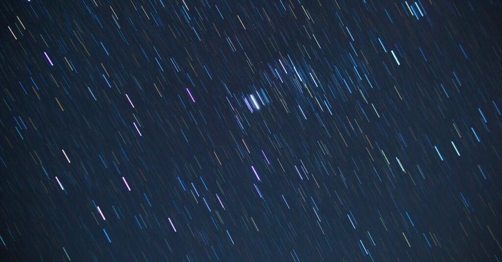 Night sky showing multiple planets aligned across the horizon at dusk