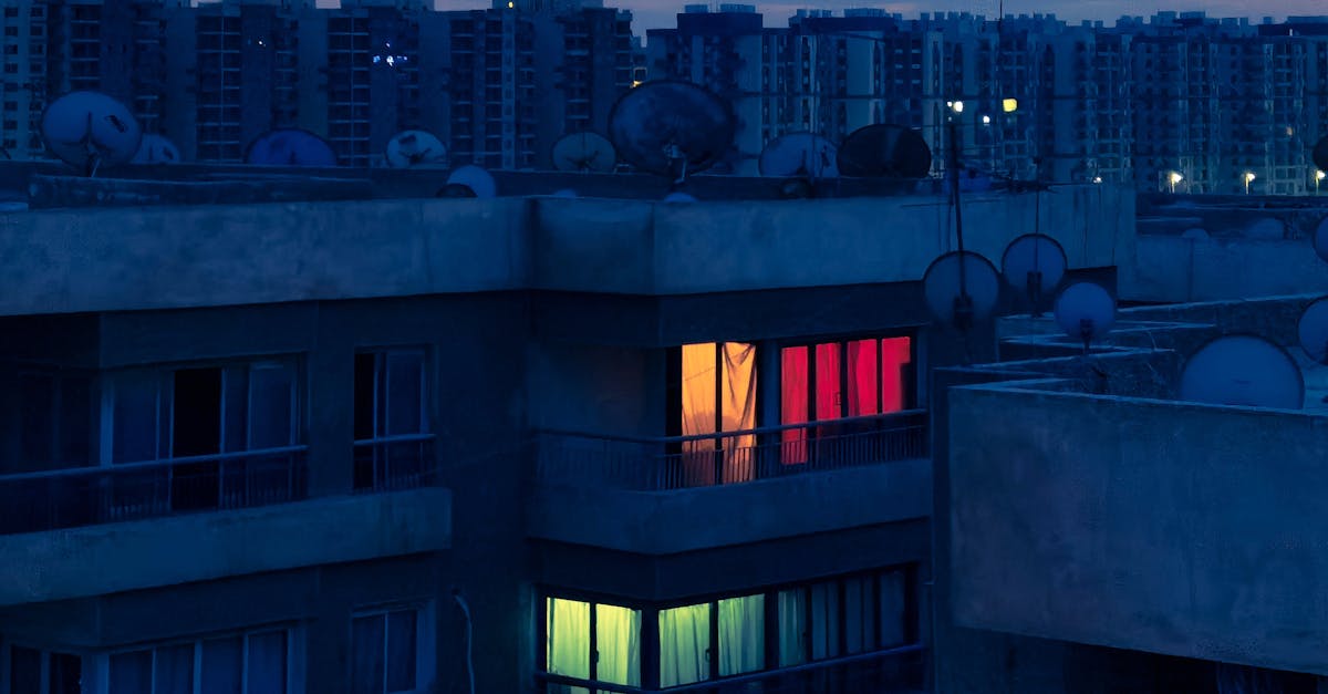 Night view of Kyiv with drone trails and Starlink antenna in foreground