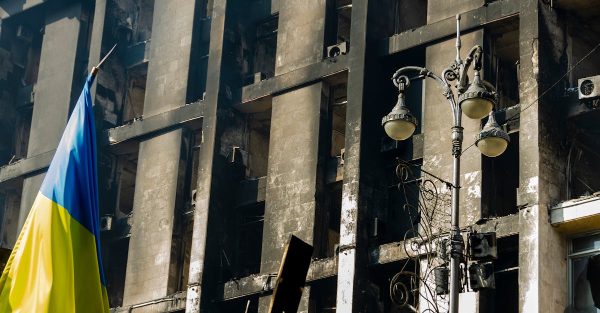 Woman holding child amid ruins in Ukraine war zone