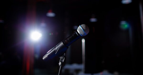 Tig Notaro performing stand-up comedy on stage