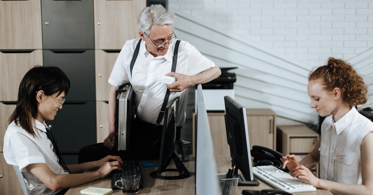 Office workers collaborating at desks in a modern business environment