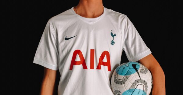 Micky van de Ven defending for Tottenham Hotspur in Premier League game