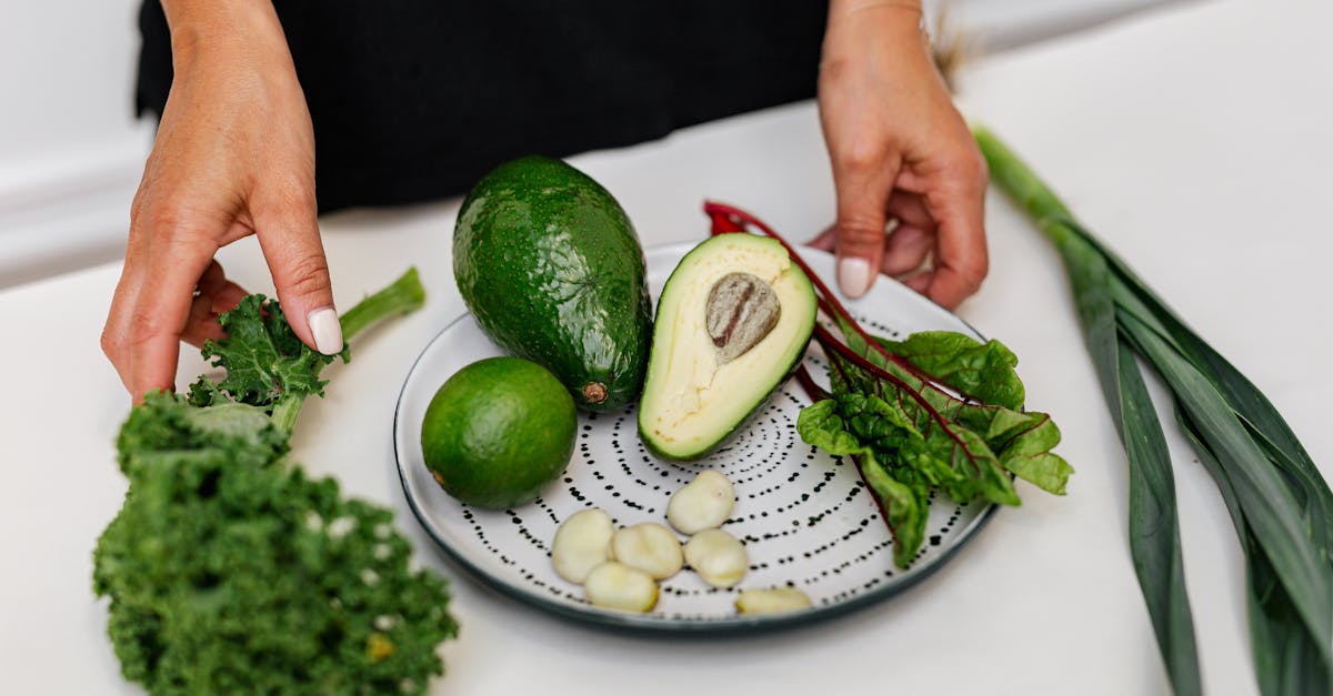 Plate filled with fruits, vegetables, and whole foods like carrots, spinach, apples, and beans